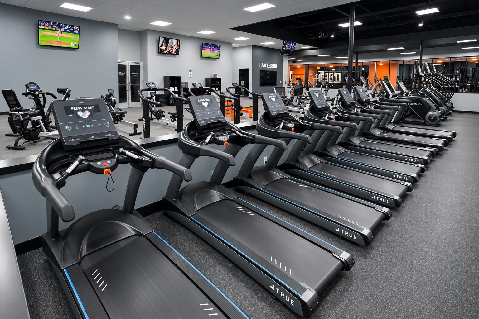 Rows of treadmills and cardio machines inside Legends Gym