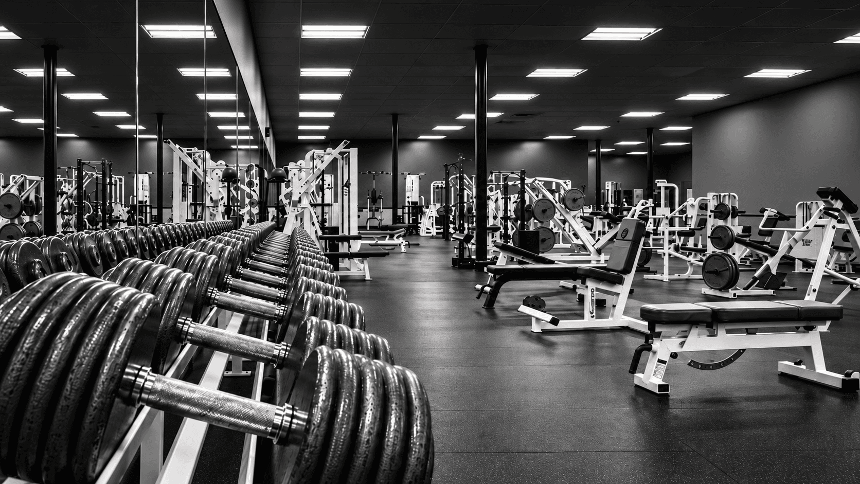 Wide view of the strength floor and equipment inside Legends Gym