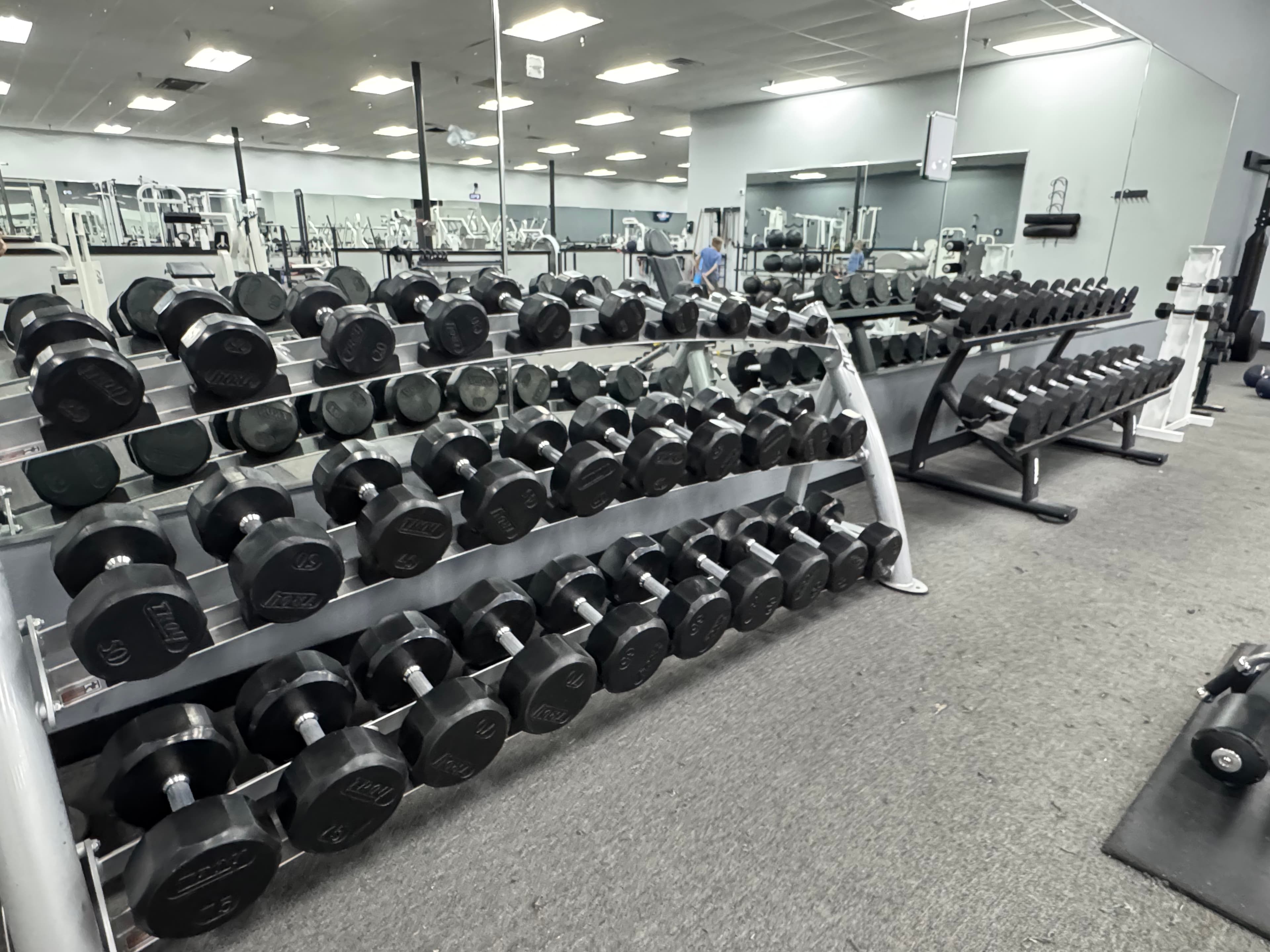 Dumbbell racks on the Legends Gym strength floor