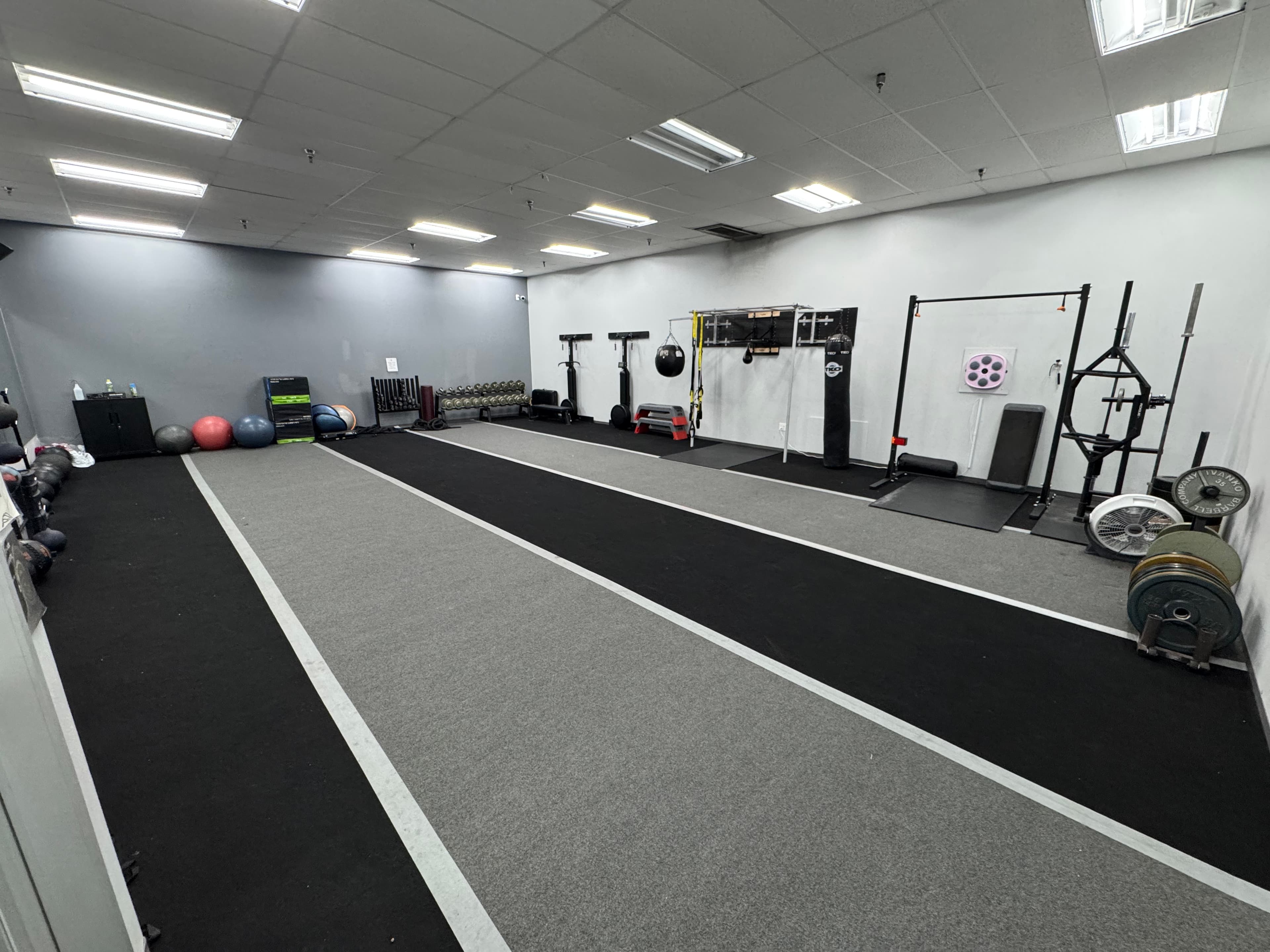 Open turf and functional training area inside Legends Gym